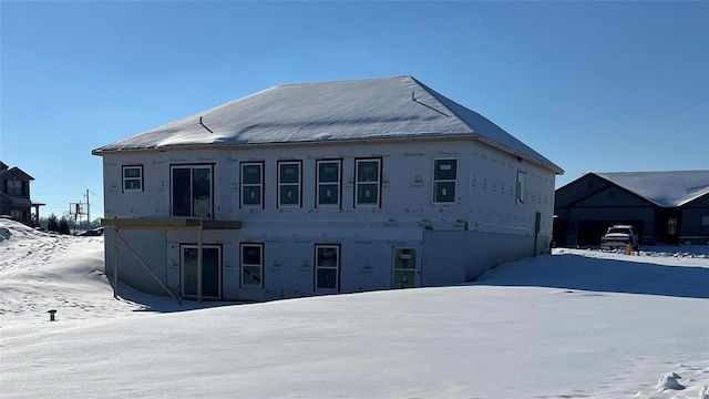 view of snow covered house