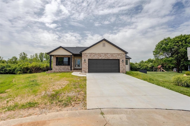 view of front of home with a playground, a garage, and a front lawn