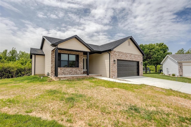 view of front of home featuring a garage and a front yard