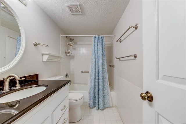 full bathroom with tile flooring, large vanity, a textured ceiling, shower / tub combo, and toilet