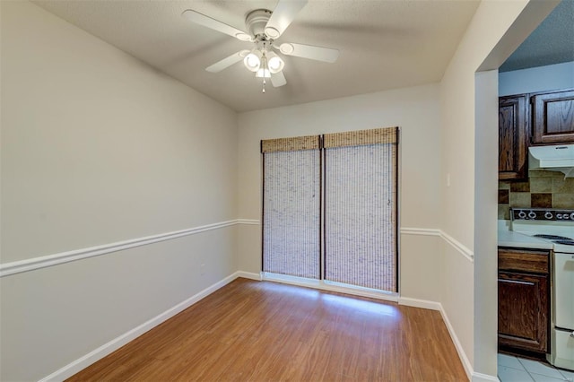 interior space featuring light hardwood / wood-style flooring and ceiling fan