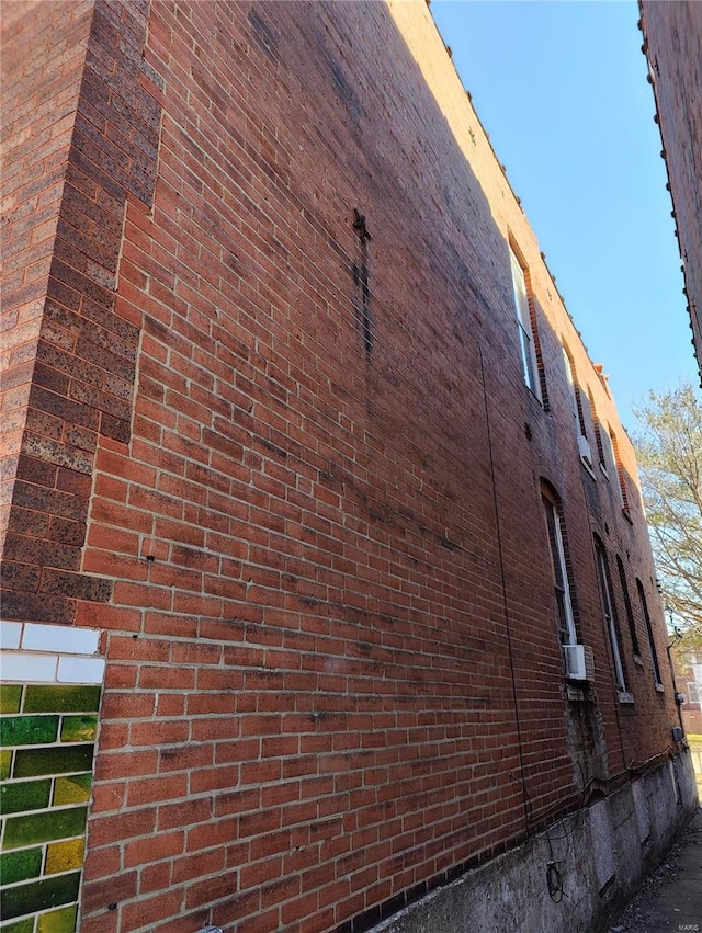 view of home's exterior with a balcony