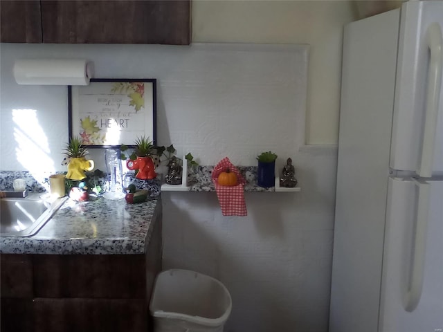 kitchen with white fridge and sink