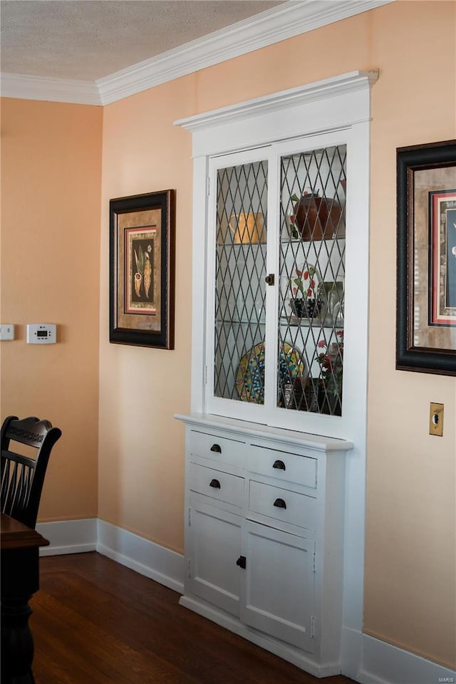 interior details featuring wood-type flooring and ornamental molding