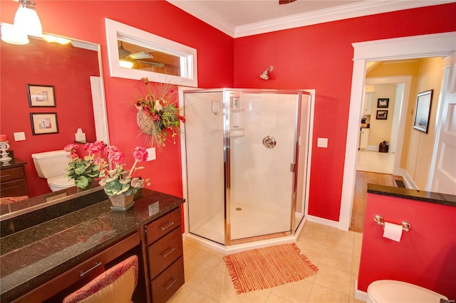 bathroom featuring an enclosed shower, vanity, ornamental molding, and toilet