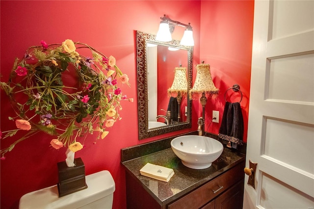 bathroom with vanity and toilet