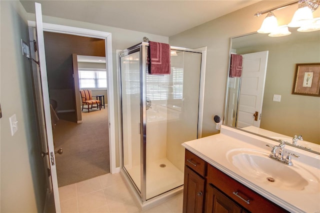 bathroom with vanity, tile patterned flooring, and a shower with door