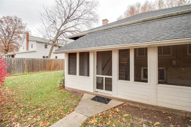 property entrance featuring a yard