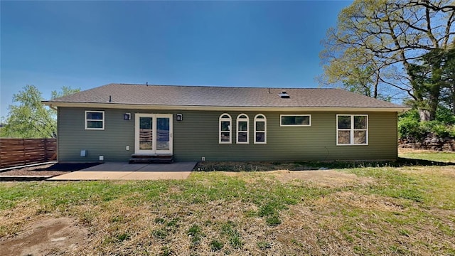 back of property featuring a yard and a patio area