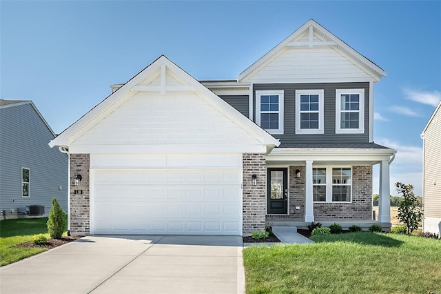 view of front of house with a garage and a front lawn