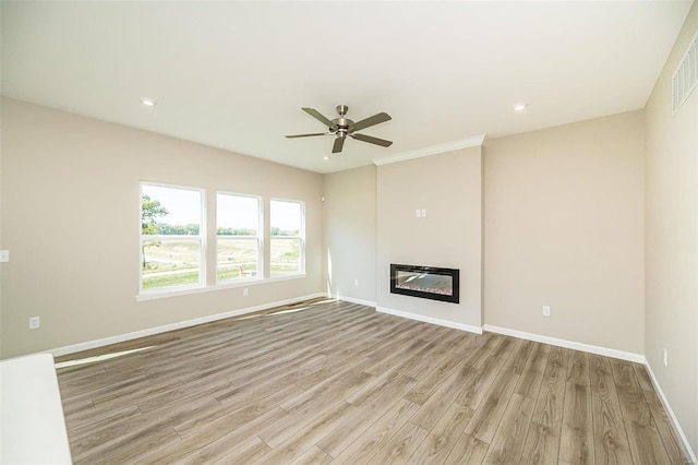 unfurnished living room with ceiling fan and light wood-type flooring