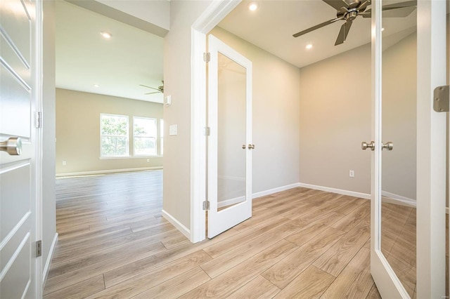 hall featuring french doors and light hardwood / wood-style flooring