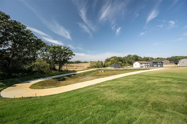 view of home's community featuring a yard