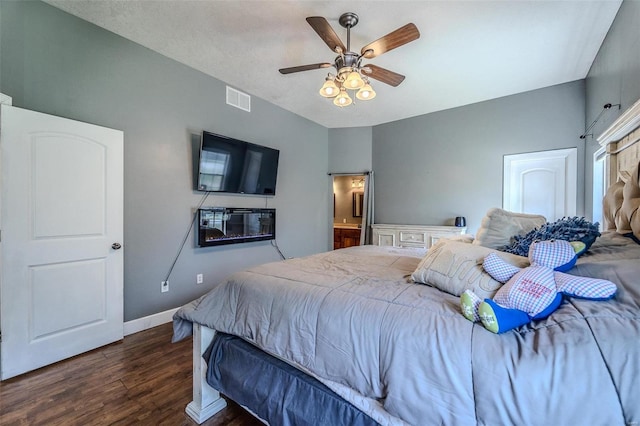 bedroom with ceiling fan and dark hardwood / wood-style floors