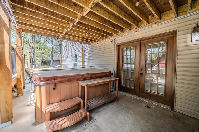 unfurnished sunroom featuring french doors