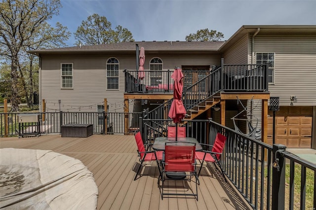 wooden terrace with a garage