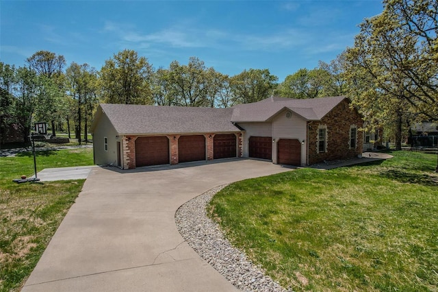 ranch-style house featuring a garage and a front yard