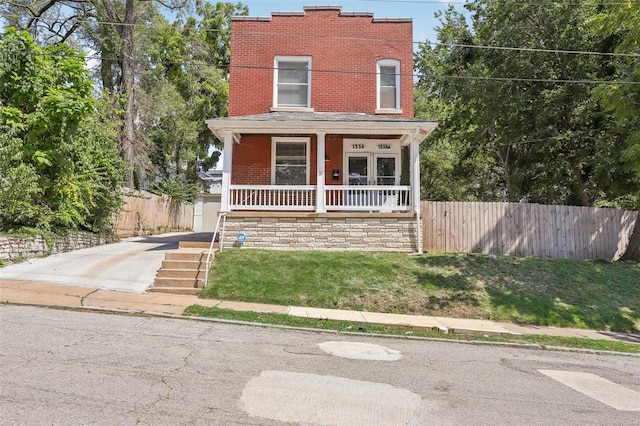 view of front of home with a front lawn and covered porch