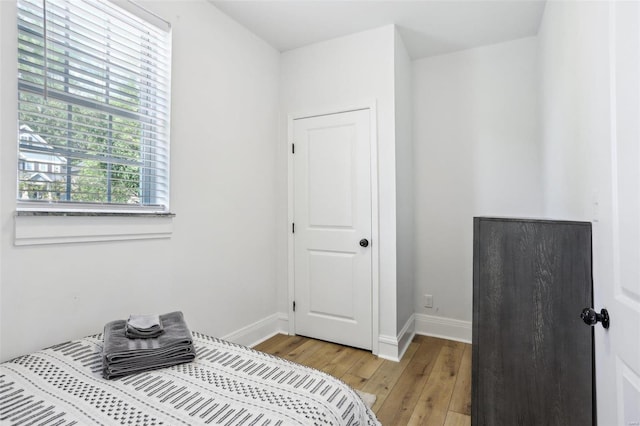 bedroom with light hardwood / wood-style flooring