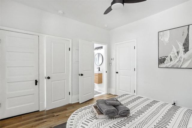 bedroom featuring wood-type flooring, ceiling fan, and ensuite bathroom