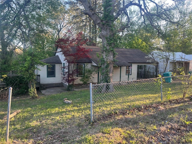 rear view of property featuring a yard