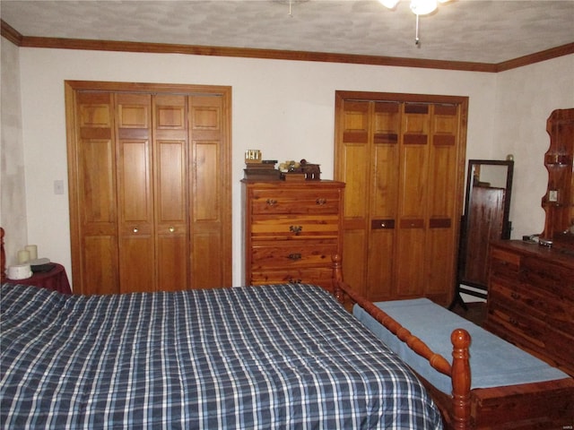 bedroom featuring crown molding, a textured ceiling, and baseboard heating