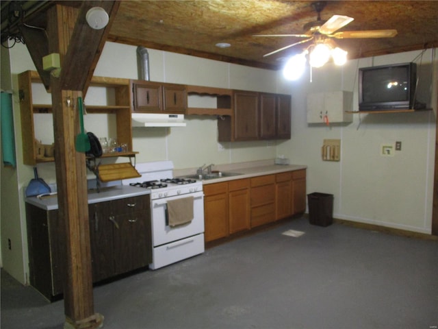 kitchen with white range with gas stovetop, sink, and ceiling fan