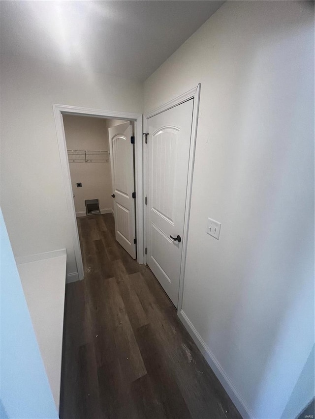 hallway featuring dark hardwood / wood-style floors