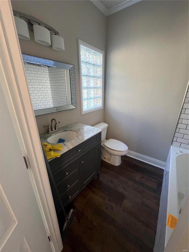 full bathroom featuring vanity, separate shower and tub, wood-type flooring, crown molding, and toilet