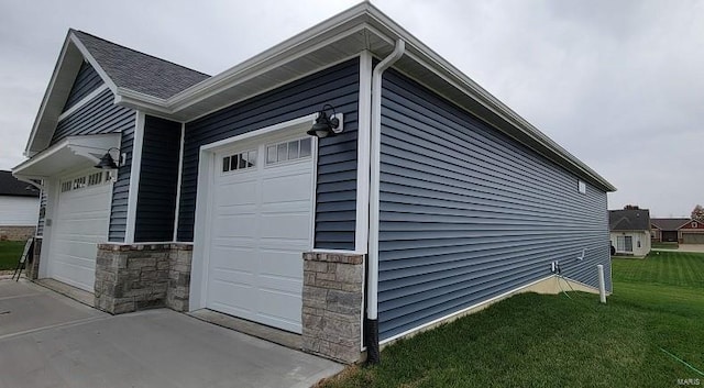 view of side of property with a yard