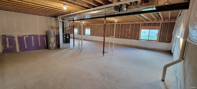 basement with plenty of natural light and electric water heater