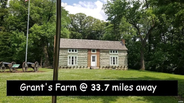 view of outbuilding featuring a yard