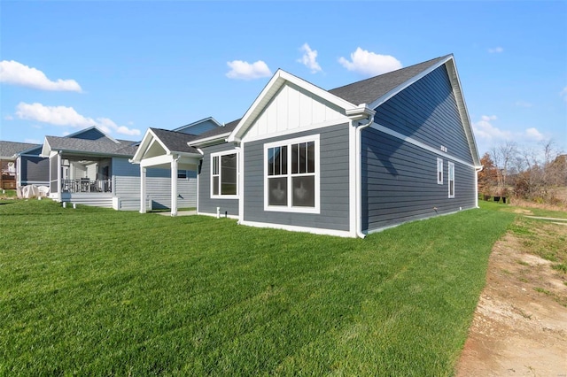 rear view of house with a lawn