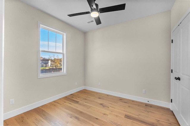 empty room featuring ceiling fan and light wood-type flooring