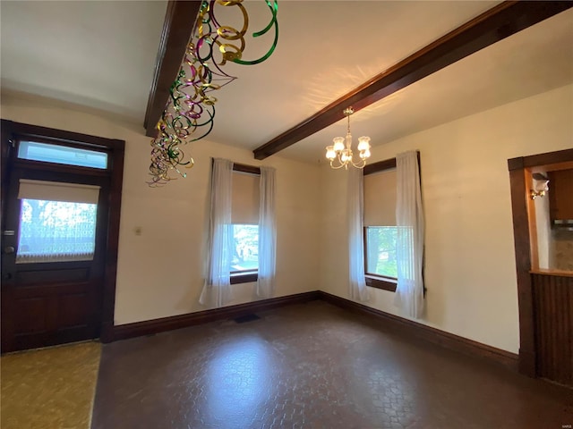 interior space featuring beam ceiling, a wealth of natural light, and an inviting chandelier