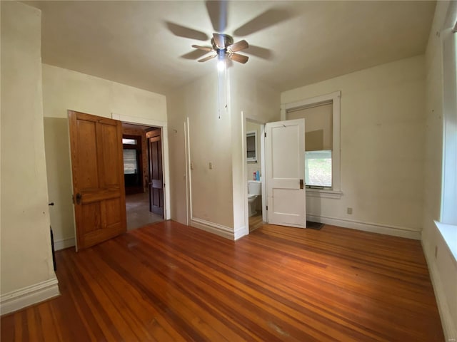 unfurnished room featuring dark hardwood / wood-style floors and ceiling fan