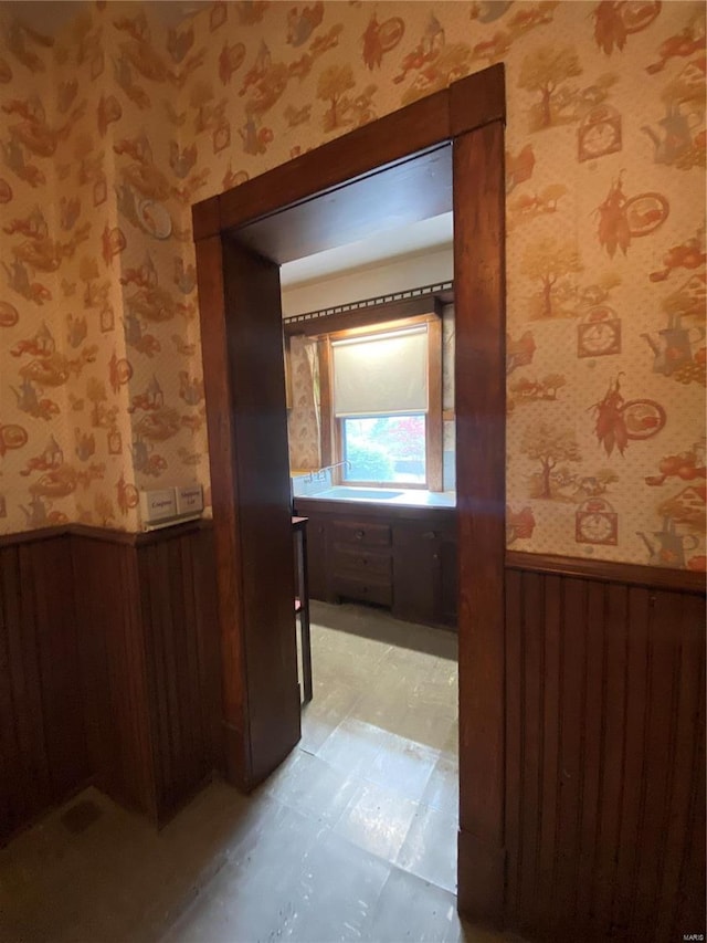 hallway with light tile floors