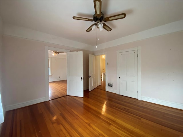 spare room featuring ceiling fan and hardwood / wood-style flooring