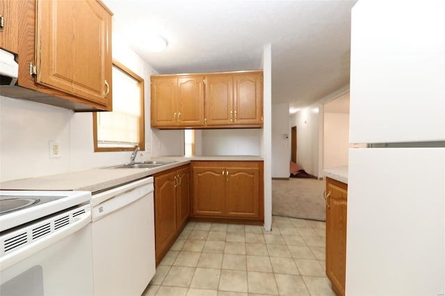 kitchen with sink, white appliances, and light tile flooring