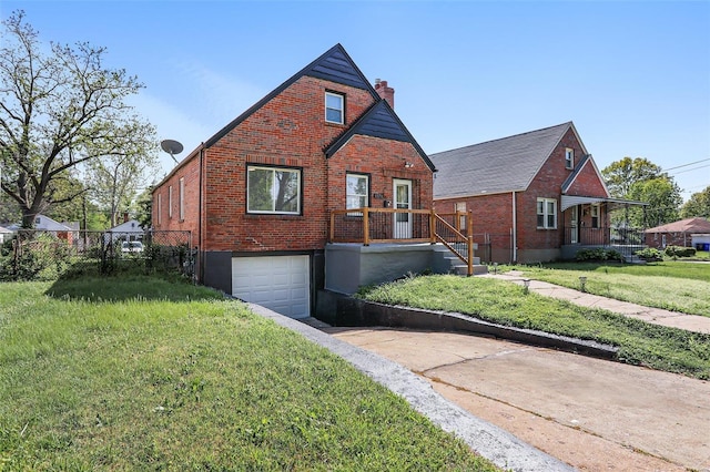 view of front of home with a garage and a front lawn