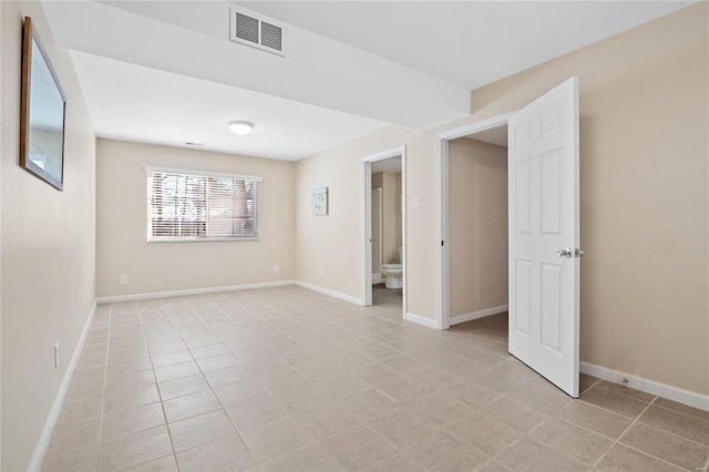 empty room featuring light tile patterned flooring