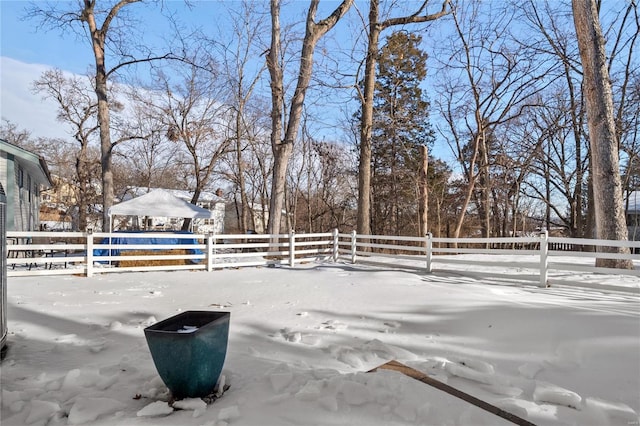 view of yard layered in snow