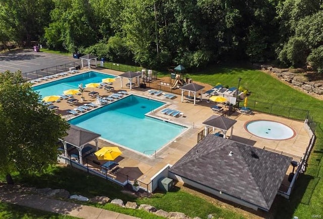 view of swimming pool featuring a patio area, a gazebo, a hot tub, and a yard