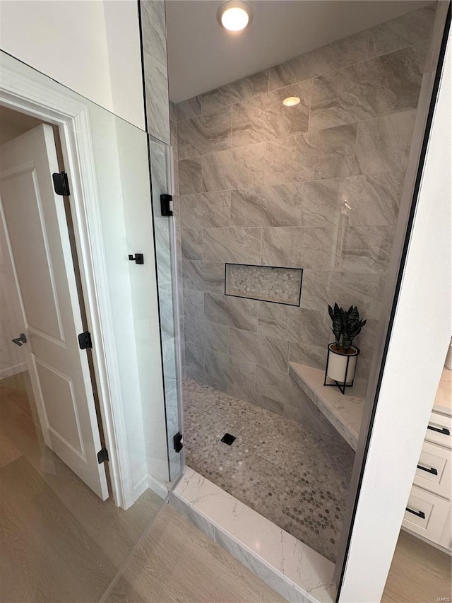 bathroom featuring a shower stall