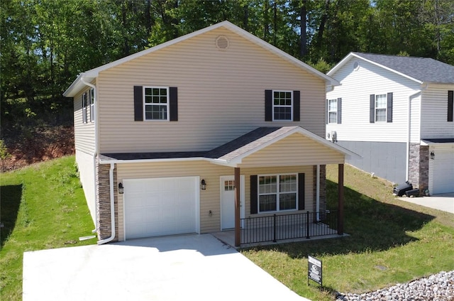 view of front of property with a garage and a front lawn