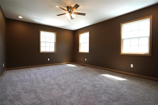 carpeted empty room with ceiling fan