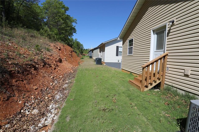 view of yard featuring central AC unit