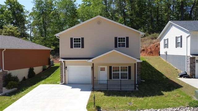 view of front facade with a garage and a front lawn