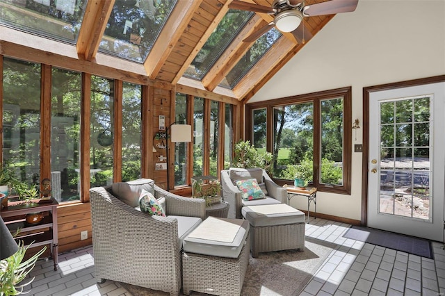 sunroom / solarium with ceiling fan, vaulted ceiling with skylight, and wooden ceiling