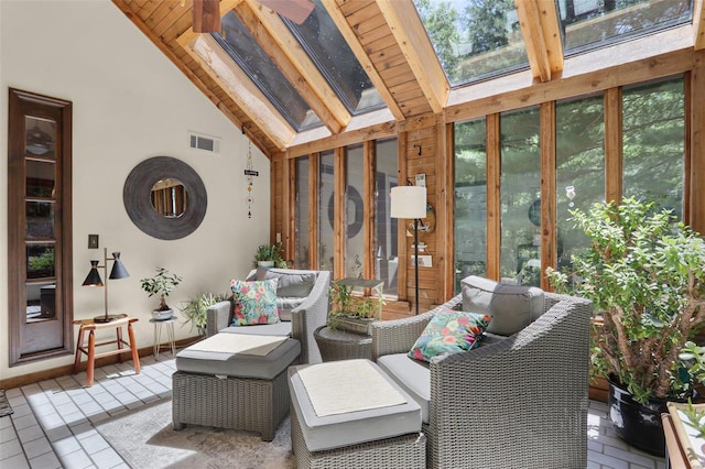 sunroom featuring vaulted ceiling with skylight and ceiling fan